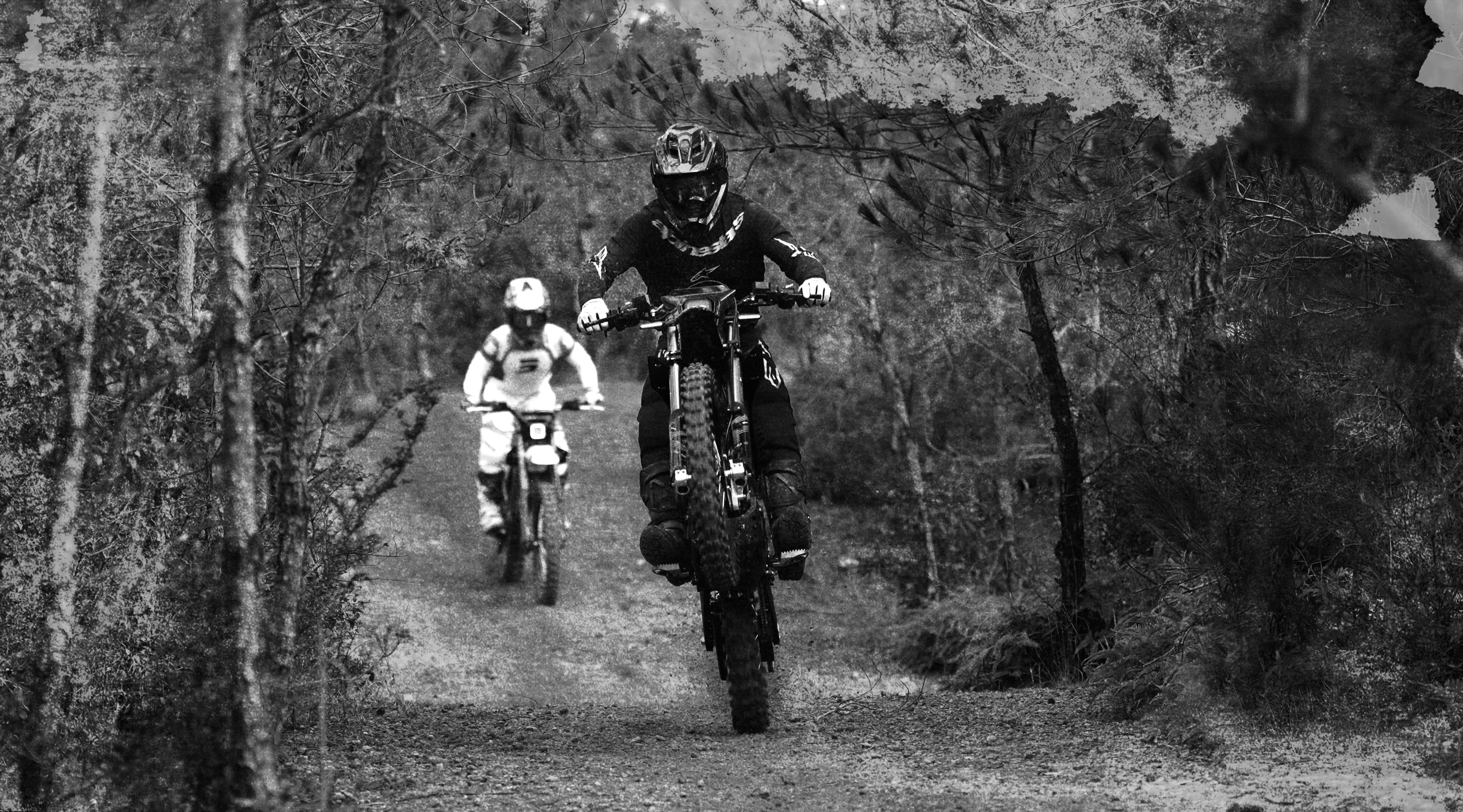 Two HOOGA riders on a forest trail